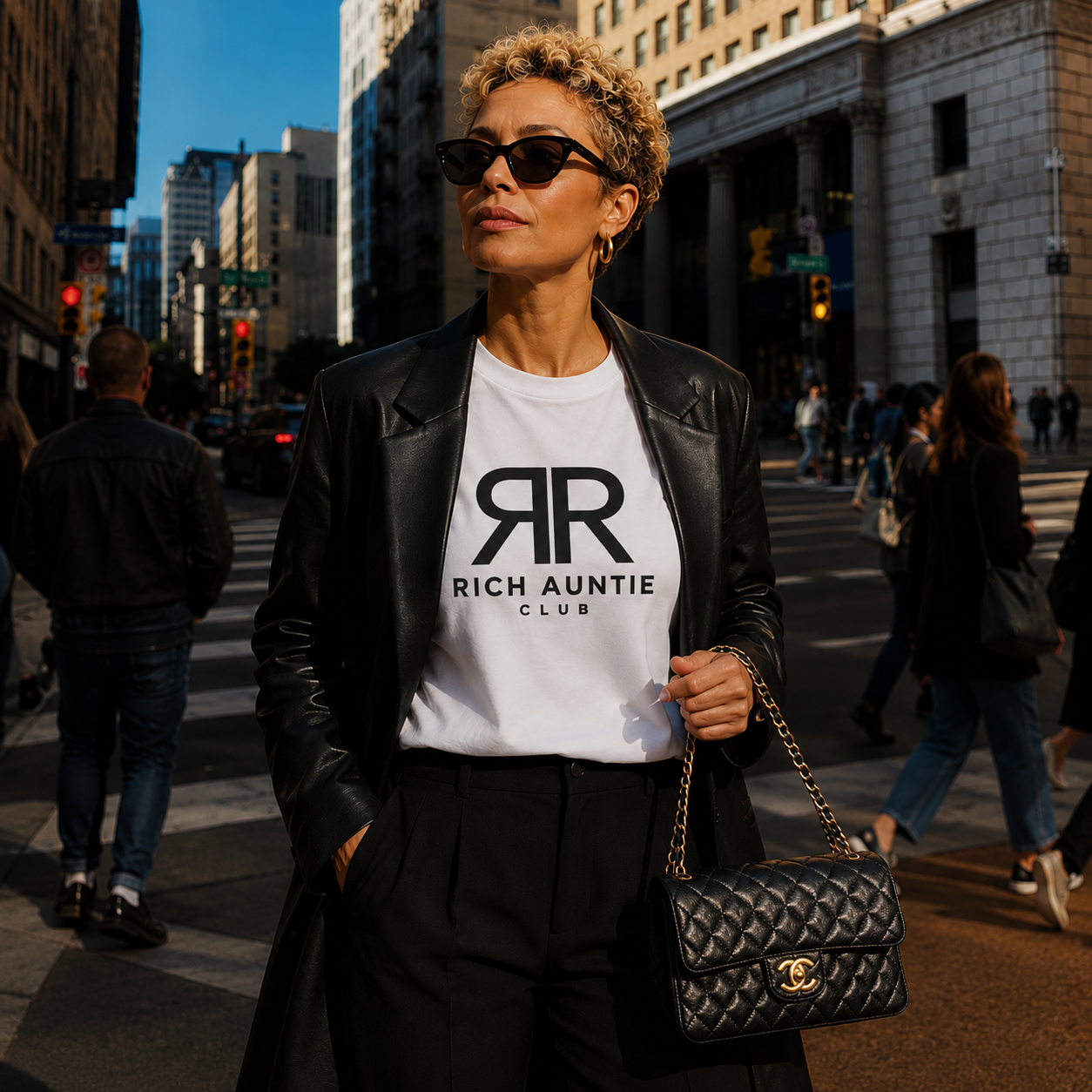 Woman wearing white B✦LENCIAGA inspired Rich Auntie Club tee with black leather blazer