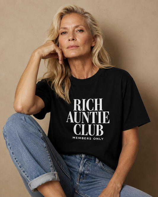 Blonde woman wearing black VOG✦E inspired Rich Auntie Club Members Only tee
